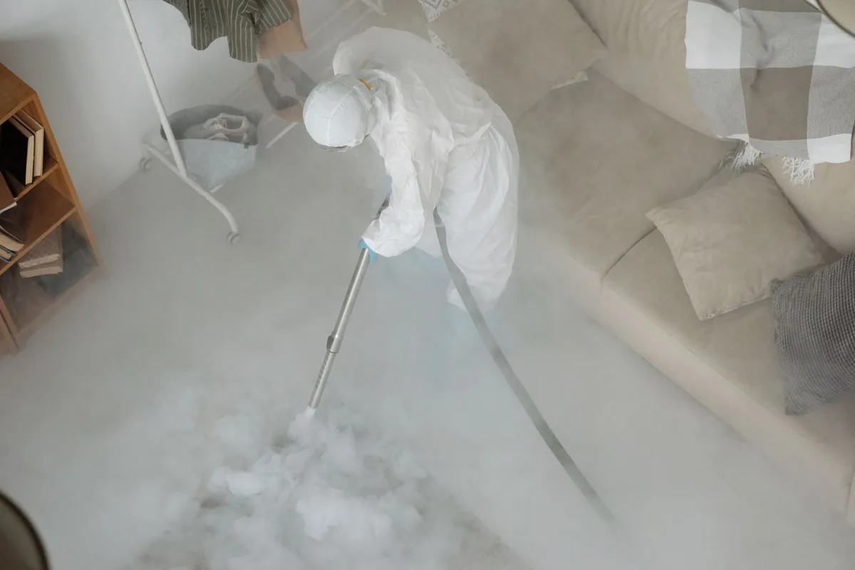 Biohazard cleanup technician in protective equipment, New Brighton, PA